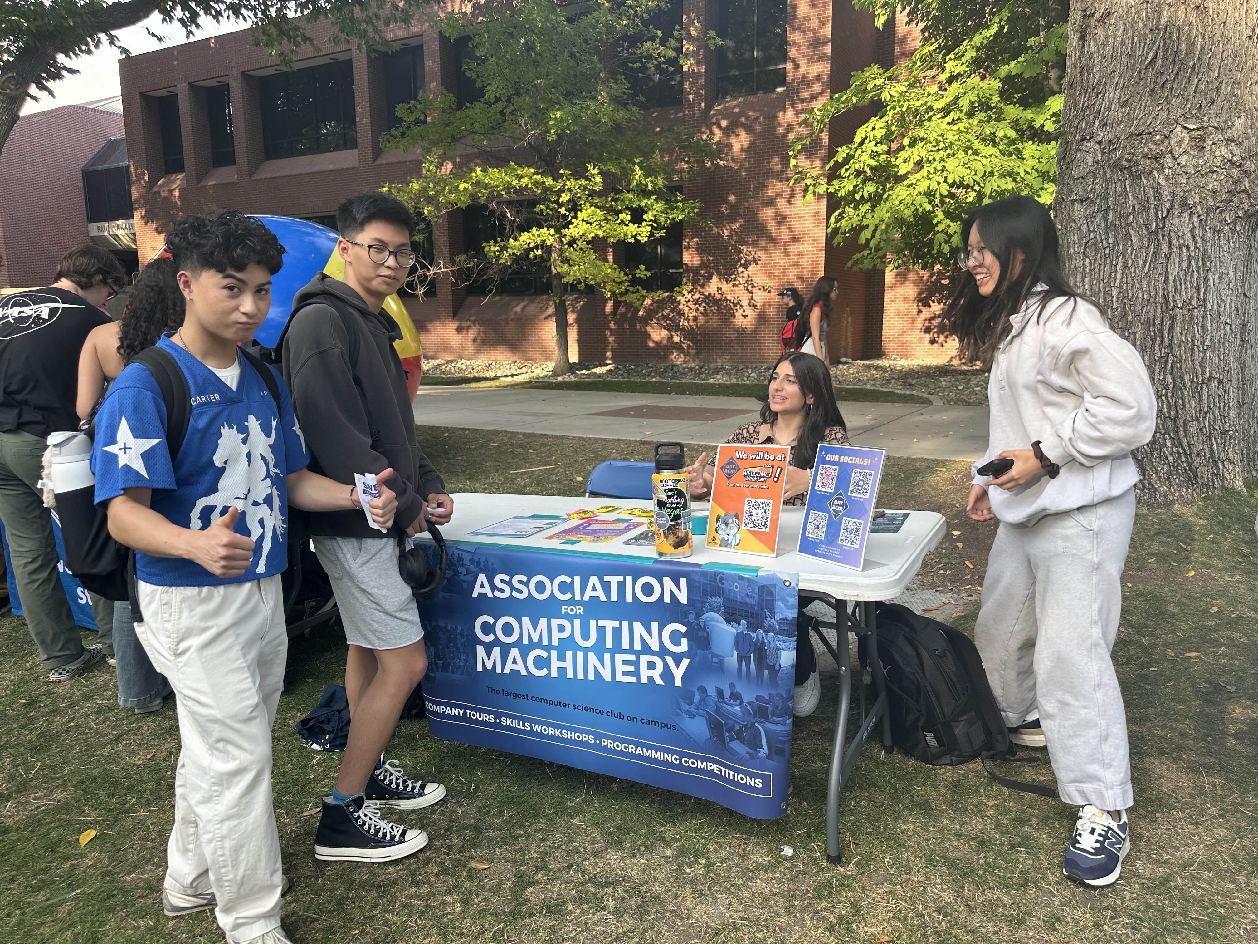 ACM President Aleena in the quad recruiting members